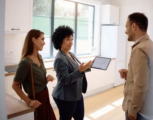 Agent discussing property details with clients