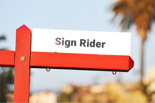 What is a real estate sign rider